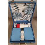 A Brexton picnic set, c.1960's, apparently complete, in a turquoise blue case.