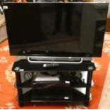 A Sony Bravia 40 inch LCD television, a Sony Blu-Ray player, a Humax Free Sat player and stand (4).