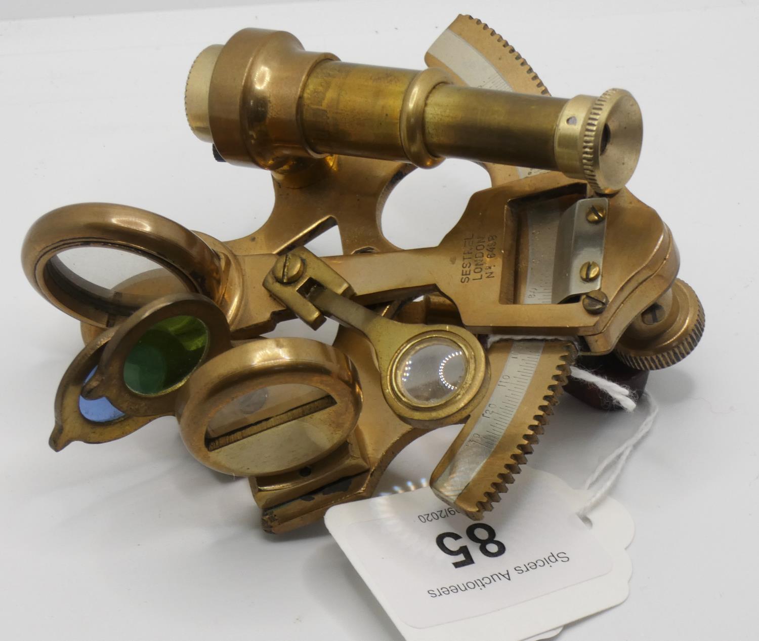 A miniature brass sextant by Sestrel London, No. 6498.