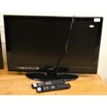 A Logic 26 inch HD television with integrated DVD player.