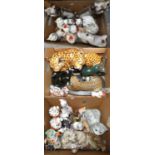 A large collection of mainly ceramic models of cats, including makers Nao, Staffordshire, 'Just Cats