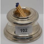 A silver match holder, Sheffield, date letter worn, in the form of a capstan, loaded