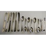 Six silver tea spoons, weight 3.5 oz and a silver handled set of six tea knives.