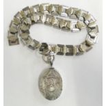 A Victorian silver locket and collar, Birmingham 1876, in the Atheistic Movement taste, length 32