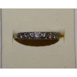 A white gold diamond half eternity ring, set with 11 brilliant cut stones, weight approximately 1ct,