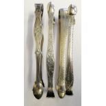 Four George III silver bright cut sugar tongs, London 1800 and 1804, two without date letters,