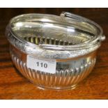 An Edwardian silver swing handle sugar bowl, Sheffield 1909, with half fluted lower body, length