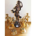 A bronze effect metal figure of a lady with a basket, 43 cm and four brass musicians, 23 cm (5).