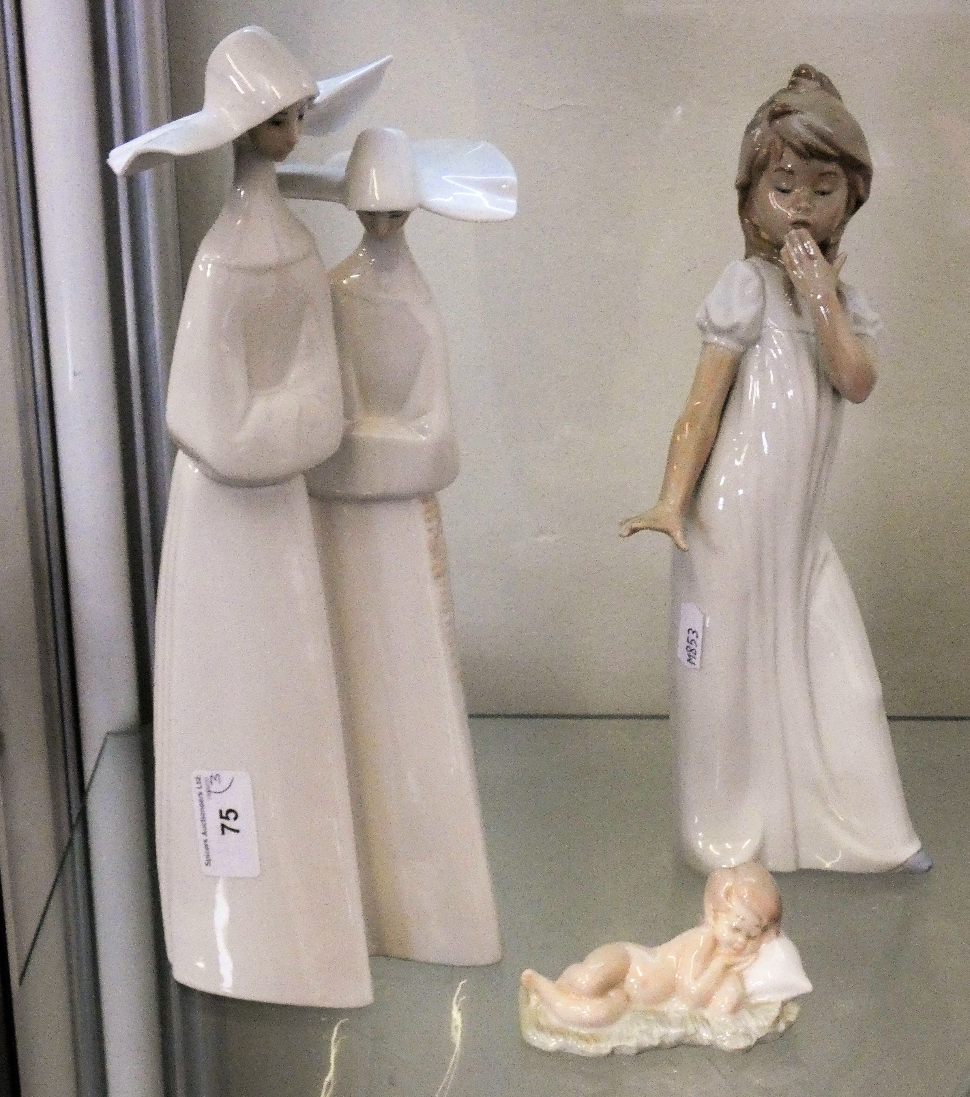 A Nao by Lladro figurine of a 'Yawning Girl', height 28cm, together with a Lladro figurine of two