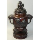 A Chinese bronze censer, with bird, Dog of Fo and two handled rooster head decoration, 44 cm.
