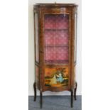 A French style walnut and painted serpentine display cabinet, with glazed door and sides, gilt metal