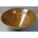 Ruth King (b.1955), a large stoneware bowl on a conical foot, initalled base, diameter 27cm.