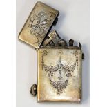 An Edwardian Sterling Silver petrol lighter, stamped sterling silver case, with ribbon and garland