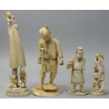 A group of four Japanese Ivory Okimono's, to include a two men beneath a fishing net, unsigned,