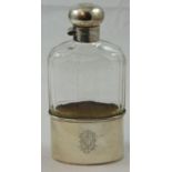 A silver and glass hip flask, London 1919, the faceted glass body with twist silver cap and pull off