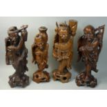 A Chinese rootwood carved figure, depicting a fisherman with a basket, 34 cm and three other similar