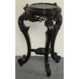 A Victorian carved ebonised hardwood jardiniere stand, with cabriole legs, height 69 cm.