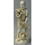 A Japanese Meiji Period Ivory Okimono, carved to depict a man with fruit, signed with red lacquer