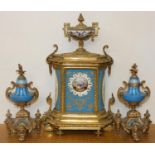 A French gilt metal and Sevres style porcelain clock garniture, retailed by Ducasse Claveau & Co.,