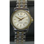 Tissot, a ladies stainless steel automatic wristwatch, model C229/329C, the silvered dial with