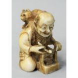 A Japanese Ivory Netsuke, carved in the form of a man with a cat on his back, signed, height 4.5 cm.