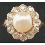 A Victorian pearl and diamond cluster ring, the peg set natural bead (untested), measuring 8 x 7.3