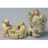 Two Japanese Ivory Netsuke, one carved as two men playing draughts, signed, height 3 cm, the other