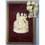 A Victorian carved ivory religious panel, depicting an angel slaying a demon bird, 7 cm and a