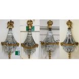 An Edwardian set of four mirrored, cut glass and gilt wall light brackets, of shaped form, with