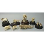 A collection of ivory animals,v to include a prowling lion, an Arab with a camel and a horse (8).