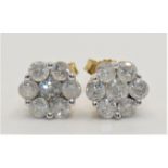 A pair of 9k diamond cluster ear studs, claw set with brilliant cut stones, approximately 1 ct