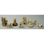 A group of eight Japanese Ivory Okimono's, to include a man with a stork (8).