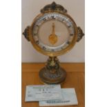 Jaeger Le Coultre; a Mystery gilt metal mantle clock, c. 1965, with silvered chapter ring, visible