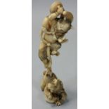 A Japanese Meiji Period Ivory Okimono, carved to depict a demon dancing on the back of an animal,