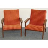 A Danish pair of rosewood armchairs, mid 20th century, with padded seats and backs.
