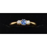 A Victorian 18ct gold sapphire and diamond three stone ring, Birmingham 1900, claw set with a