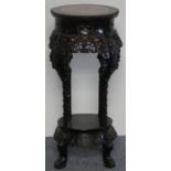 A Chinese hardwood jardiniere stand, with marble panel carved and shaped supports, height 81 cm.