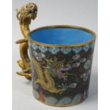 A Chinese cloisonne tea glass holder, with five claw dragon decoration and gilt dragon handle, 9 cm.