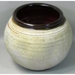 Charles Bound (b.1939), a globular bowl with mottled glaze finish on a cream ground, ribbed rim,
