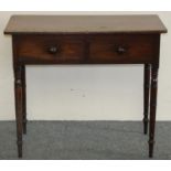 A Georgian mahogany side table, with two frieze drawers, turned tapering legs, 85 x 47 x 72 cm.