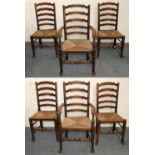 A George III set of six Lancashire style oak wavy ladder back dining chairs, two carvers and four