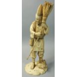 A Japanese Meiji period sectional ivory Okimono, in the form of a farmer with a brush and a cockerel