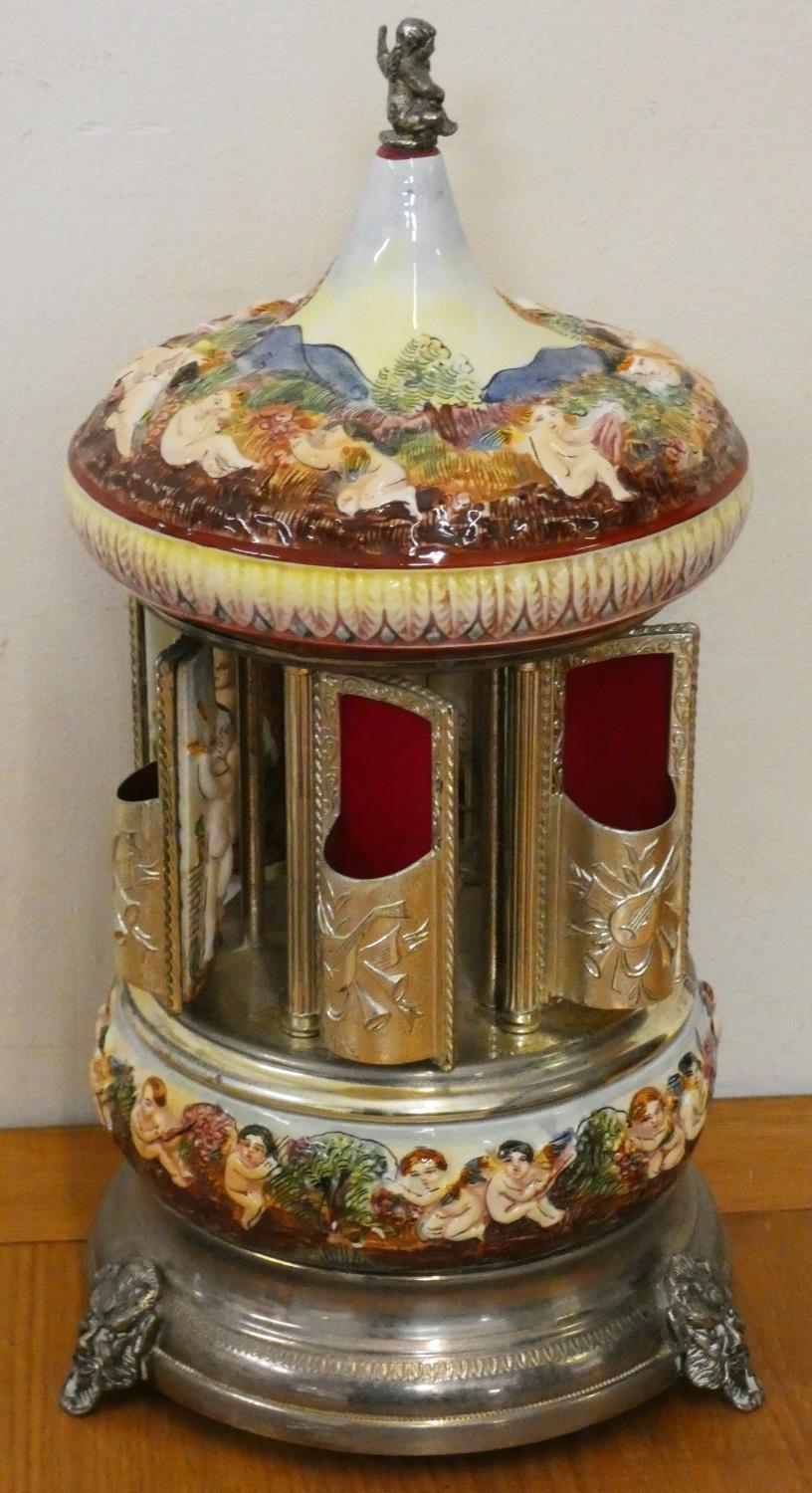 A polychrome porcelain and electroplate cigarette dispenser carousel, decorated with raised - Image 2 of 2