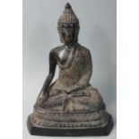A bronze figure of a seated Buddha, possibly Tibetan, height 20 cm.
