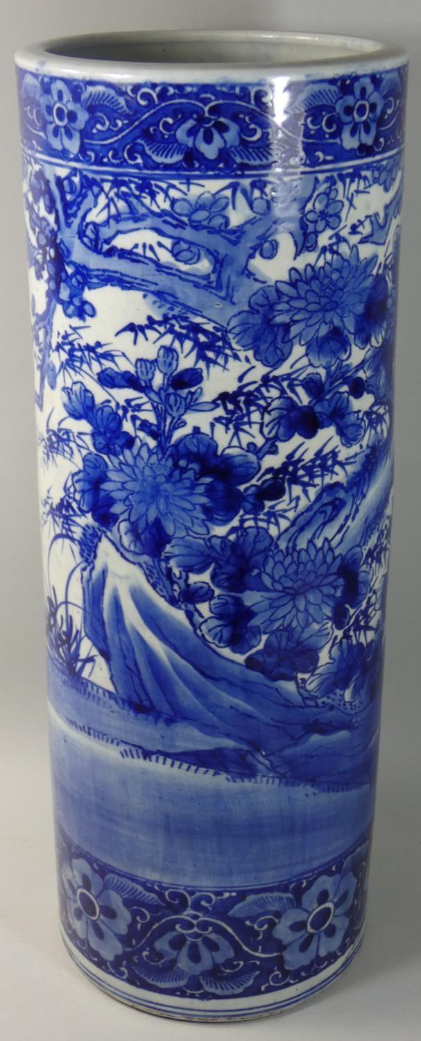 A Chinese blue and white stick stand, decorated with birds in a tree, double blue line to base, - Image 2 of 2