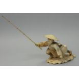 A Japanese Meiji period Ivory Okimono, carved to depict a fisherman with a bamboo rod and basket,