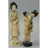 A Japanese Ivory Okimono, carved to depict a lady with a mirror, black hair, signed, height 15 cm