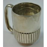 A Victorian silver christening mug, London 1900, with reeded lower section, height 8.5 cm, weight