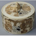 A Chinese Ivory circular box, carved and painted with elephant, lion, tiger and monkey, diameter