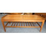 A Remploy teak extending coffee table, mid 20th century, the leaves extending, revealing a Formica